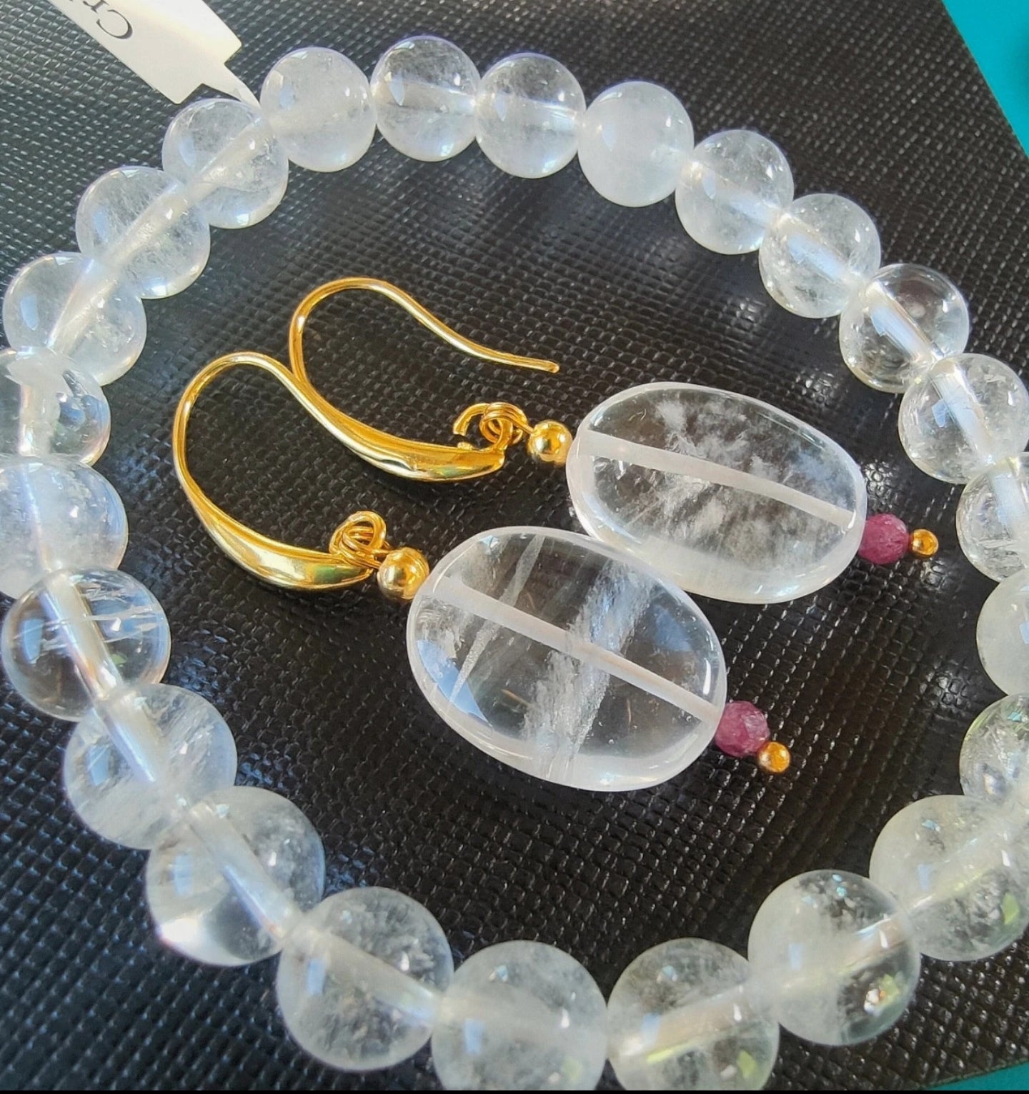 Parure Bracelet et boucle d'oreilles en Cristal de roche et rubis