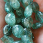 Perle Olive en Apatite verte 6 à 8 mm - à l'unité